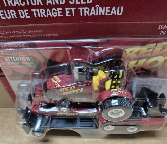 1/64 Case IH "Red Hot!" Pulling Tractor with Sled - Image 3